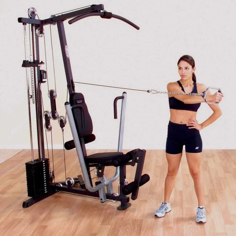 Body-Solid Single Stack Home Gym G1S - Woman standing beside G1S pulling weights