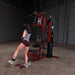 Body-Solid Single Stack Home Gym G6BR - Woman in gray shirt doing leg workout using single stack home gym