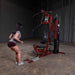 Body-Solid Single Stack Home Gym G6BR - Female model pulling rope while doing squats