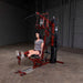 Body-Solid Single Stack Home Gym G6BR - Woman sitting on bench lifting her legs doing workout