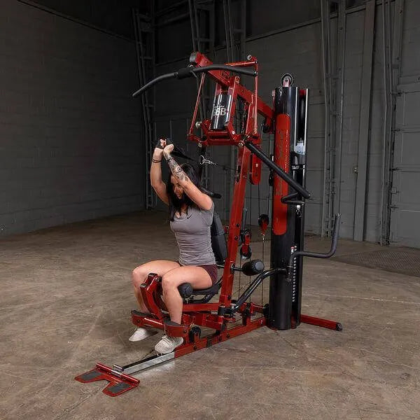 Body-Solid Single Stack Home Gym G6BR - Woman in gray shirt sitting on bench while doing arm workout