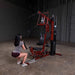 Body-Solid Single Stack Home Gym G6BR - Woman in gray shirt doing squat workout while pulling rope from G6BR210LB