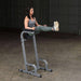 Body-Solid Vertical Knee Raise and Dip GVKR60 - Woman lifting her legs