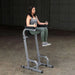 Body-Solid Vertical Knee Raise and Dip GVKR60 - Woman doing knee raise