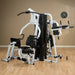 Body-Solid Vertical Knee Raise Station VKR30 - Assembled in a room with beige walls with a clock attached