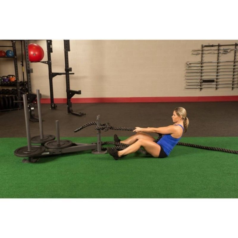 Body-Solid Weight Sled GWS100 - Woman in blue shirt pulling a black rope