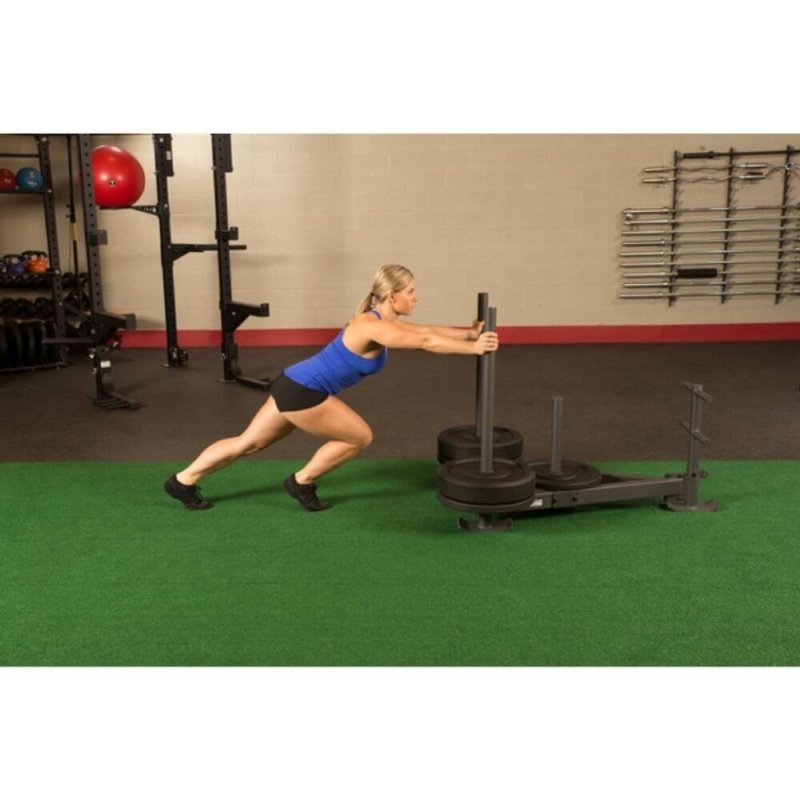 Body-Solid Weight Sled GWS100 - Female model pushing weight sled