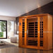 Dynamic Bergamo 4-Person Low EMF FAR Infrared Sauna - Set up in a living room with wooden walls