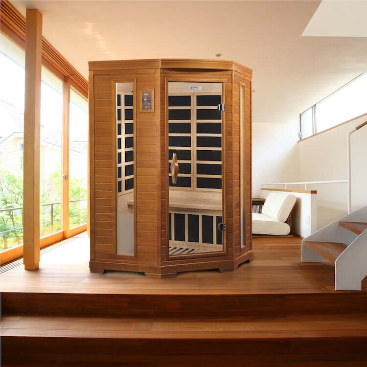 Dynamic Heming Elite 2-Person Corner Ultra Low EMF FAR Infrared Sauna (Canadian Hemlock) - Sauna set up in a room with glass sliding door and wooden floor