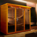 Dynamic Monaco 6-Person Ultra Low EMF FAR Infrared Sauna (Canadian Hemlock) - Sauna set up in a living room with wooden wall