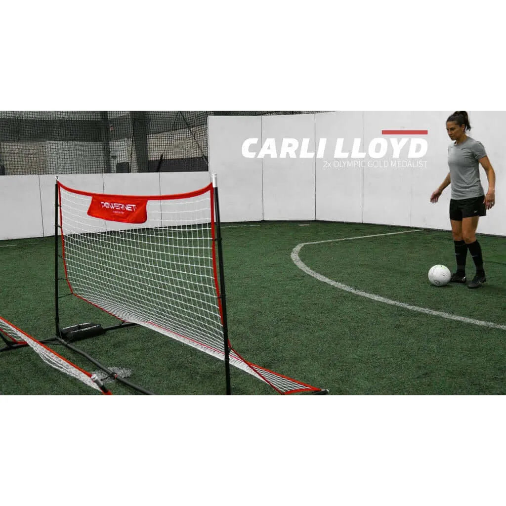 Olympic gold medalist Carli Lloyd is playing soccer indoors using Powernet Fast Pass Rebounder Soccer Trainer 6x4 FT 1126
