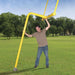 First Team Gridiron Football Backyard Field Goalposts (Pair) - Man setting up goal post outdoor