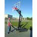 First Team OmniSlam Portable Basketball Hoop - Person setting up outdoor