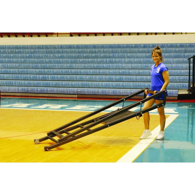 First Team SturdiStand Folding Volleyball Judges Stand - Woman holding folded stand