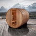 Golden Designs "Arosa" 4 Person Barrel Traditional Steam Sauna - Pacific Cedar - a wooden barrel on a deck with mountains in the background