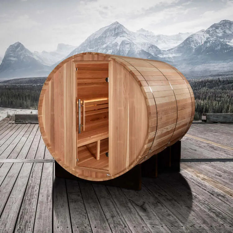 Golden Designs "Klosters" 6 Person Barrel Traditional Steam Sauna - Pacific Cedar - a wooden barrel on a wooden deck with mountains in the background