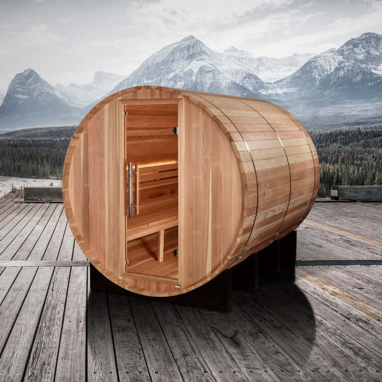 Golden Designs "Klosters" 6 Person Barrel Traditional Steam Sauna - Pacific Cedar - a wooden barrel on a wooden deck with mountains in the background