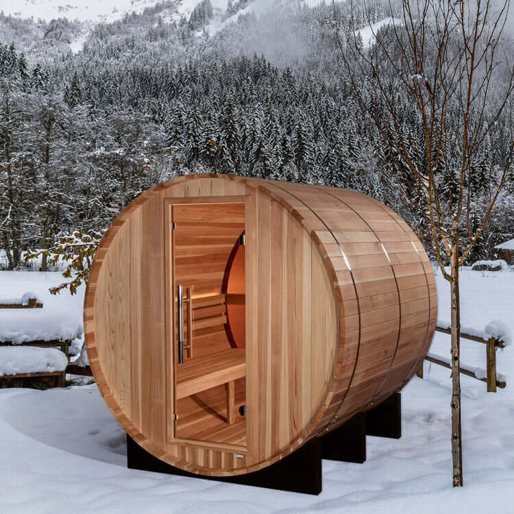 Golden Designs "Zurich" 4 Person Barrel with Bronze Privacy View - Traditional Steam Sauna - Pacific Cedar - a wooden barrel in the snow