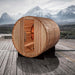 Golden Designs "Zurich" 4 Person Barrel with Bronze Privacy View - Traditional Steam Sauna - Pacific Cedar - a wooden barrel on a deck with mountains in the background