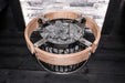 Harvia Embedding Flange for Cilindro Half Series Sauna Heaters - basket made with wood and metal, filled with rocks