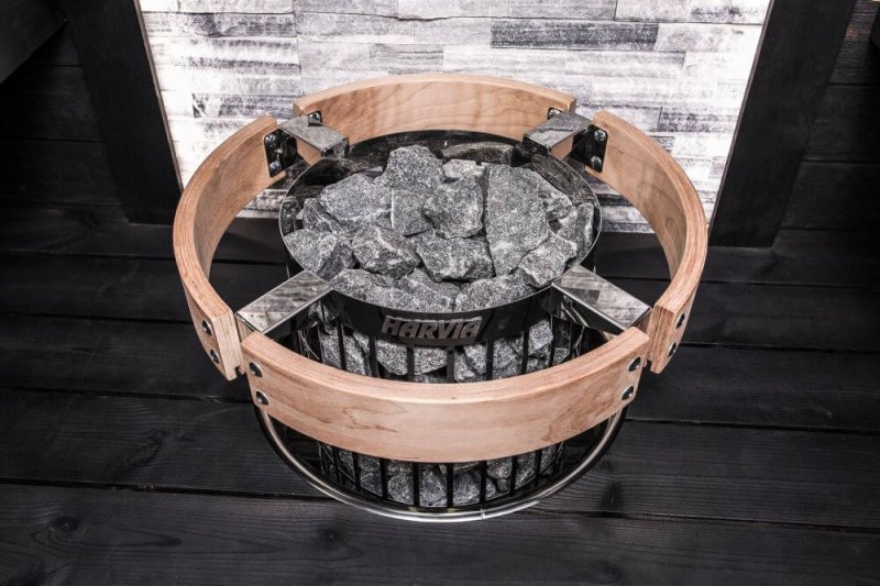 Harvia Embedding Flange for Cilindro Half Series Sauna Heaters - basket made with wood and metal, filled with rocks