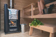 Harvia Pro Series 20 Wood Stove Sauna Heater with Water Tank - next to a person inside a sauna room