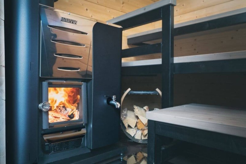 Harvia Pro Series 24.1 kW Wood Burning Sauna Heater with Water Tank - with flaming firewoods inside