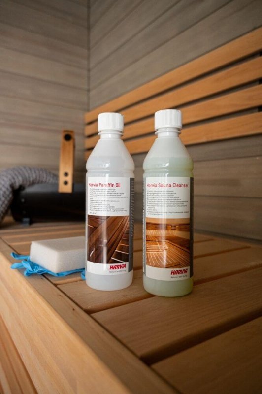 Harvia Sauna Wood 16.9oz (500ml) Paraffin Oil - bottles placed on a bench