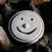 Hukka Saunaveijari Sauna Smiley Stone - With regular sauna stones in the background