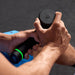 Hyperice Hypervolt 3 Pro - close up image of hands holding Hypervolt