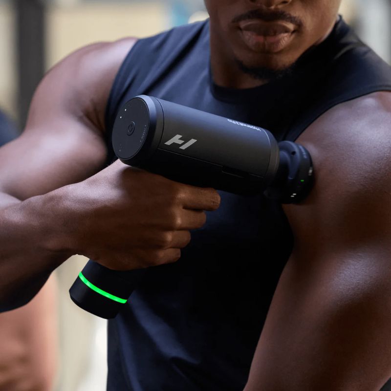 Hyperice Hypervolt 3 Pro - close up image of a man using Hypervolt on his left arm