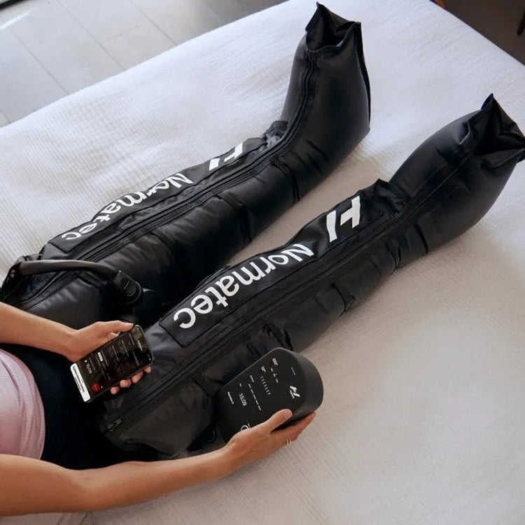 Hyperice Normatec 3 Leg Recovery System - Half body view of a person wearing leg recovery system on both legs
