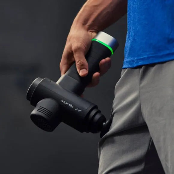 Hypervolt 2 Pro Massage Gun - Close up photo of a hand holding massage gun