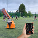 Soccer ball launcher in use with remote 