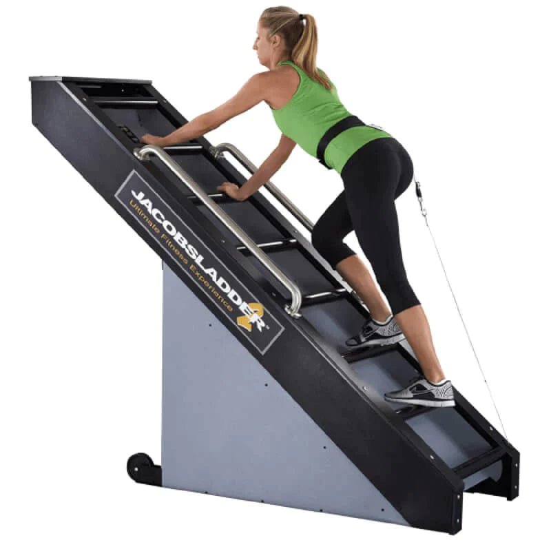 Jacobs Ladder 2 Residential Ladder Climbing Machine - A woman in green top climbing