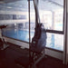 Marpo VLT Rope Trainer - In a gym beside glass window with olympic pool outside view