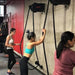 Marpo X8 Mountable Rope Trainer - a group of women facing the wall and using rope trainer