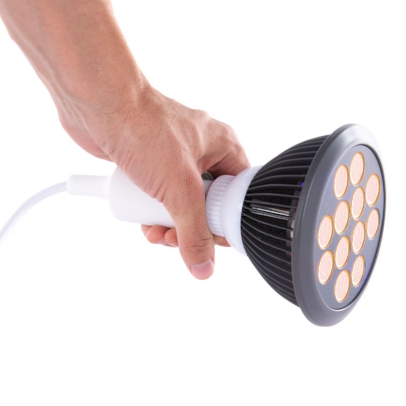 Orange LED Light Therapy - hand holding the bulb