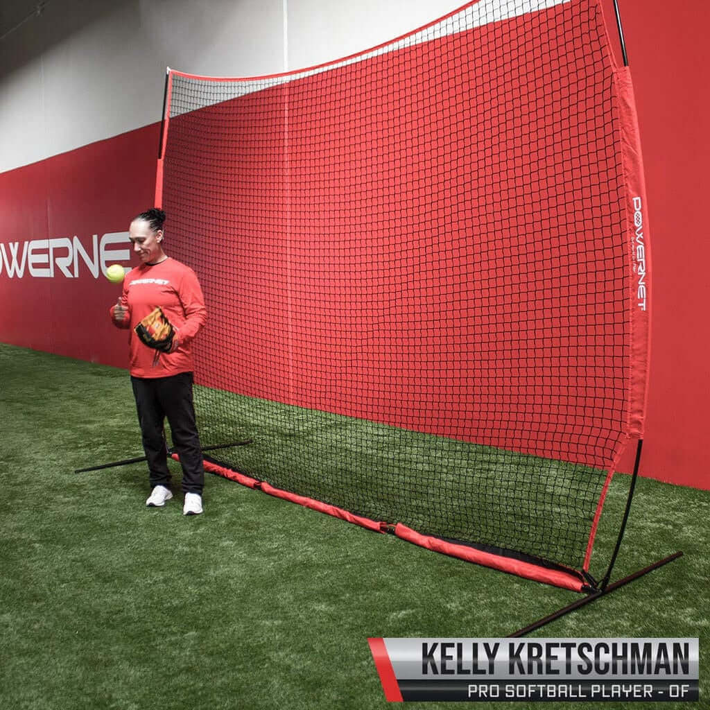 Powernet 12x9 Sports Barrier Net 1021 -pro softball player using the net