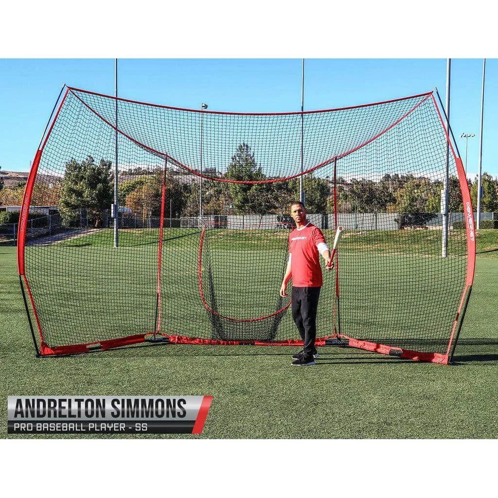 Pro baseball player Andrelton Simmons posing in front of Powernet 16' x 9' Portable Baseball Backstop 1149