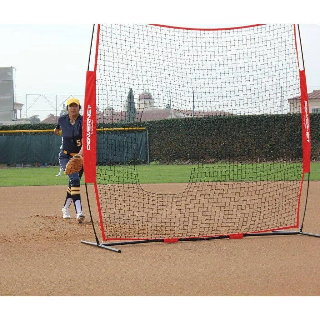 A girl playing outdoors beside Powernet 7x7 FT Pitch-Thru Protection Screen for Softball 49 SQFT Barrier 1090
