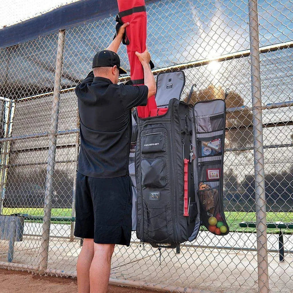 A person putting equipment in Powernet All Gear Transporter Rolling Baseball Equipment Bag for Coaches B007