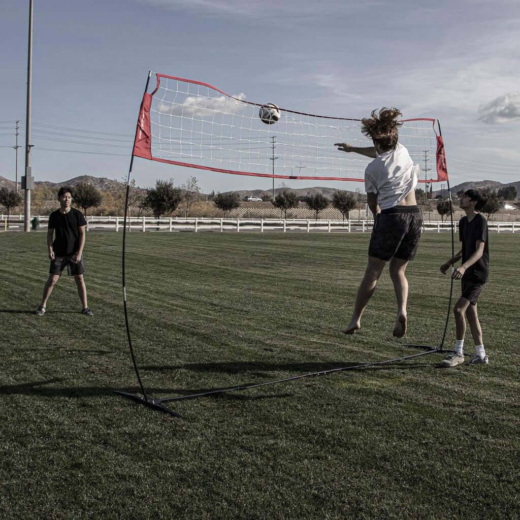 Powernet Freestanding Volleyball Warm Up Net 1178 - with woman doing a volleball spike 