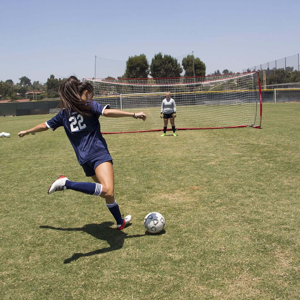 Two girls playing outdoor soccer using Powernet Soccer Goal Regulation Size 24x8 Net S007