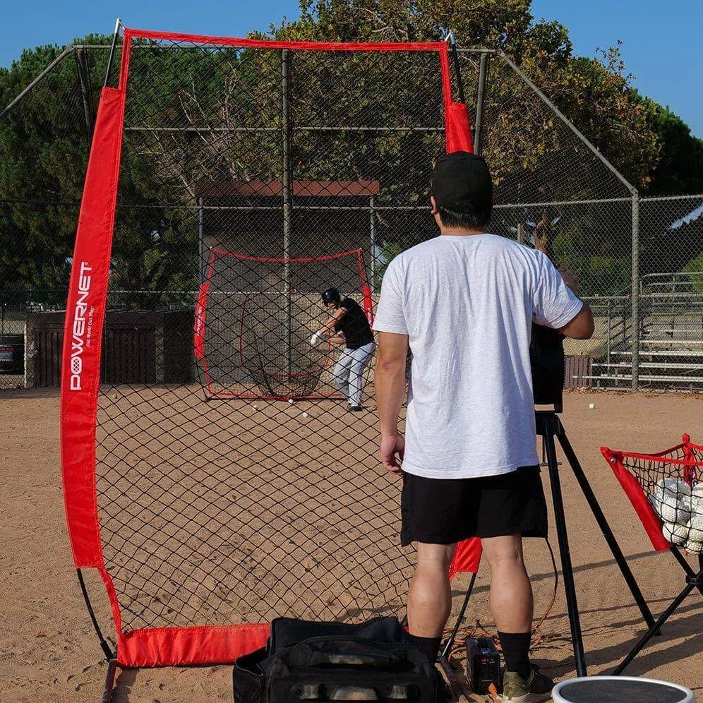 Powernet I-Screen Net for Batting Practice - A man stands confidently in front of a baseball batting cage