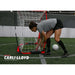 Olympic gold medalist Carli Lloyd beside Powernet Soccer Goal 8x4 Portable Bow Style Net S002