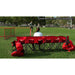 A girl sitting in a Powernet 6-Seater Team Bench 1209 watching a boy play soccer