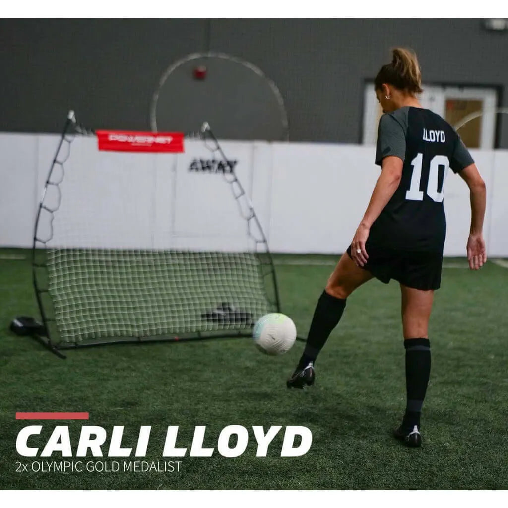Powernet Rebounder Training Net 1125 - Carli Lloyd is poised to kick a soccer ball towards a training net