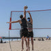 Powernet Volleyball Four Square Net used by two people playing beach volleyball