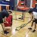 Two people disassembling Powernet Volleyball Wheeled Cart 1188